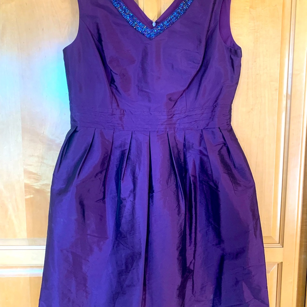 Gorgeous purple cocktail dress with bead embellished neckline. And POCKETS!